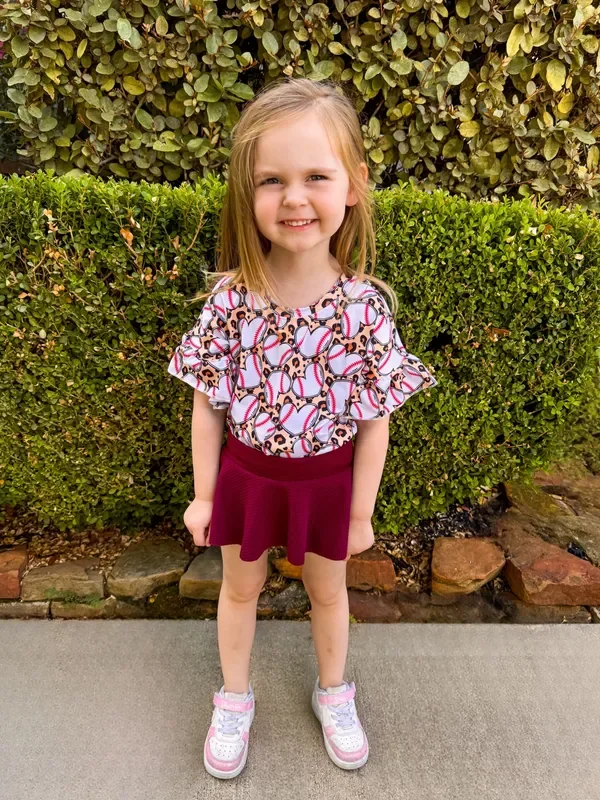 Leopard baseball ruffle top