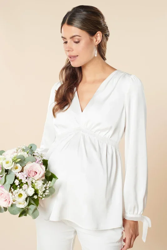 Maternity blouse with bow cuffs