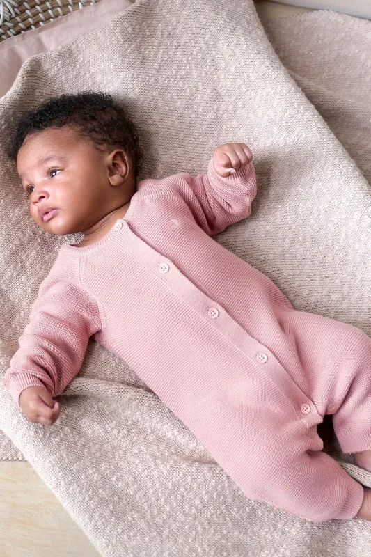 Organic knitted romper with button placket, pink